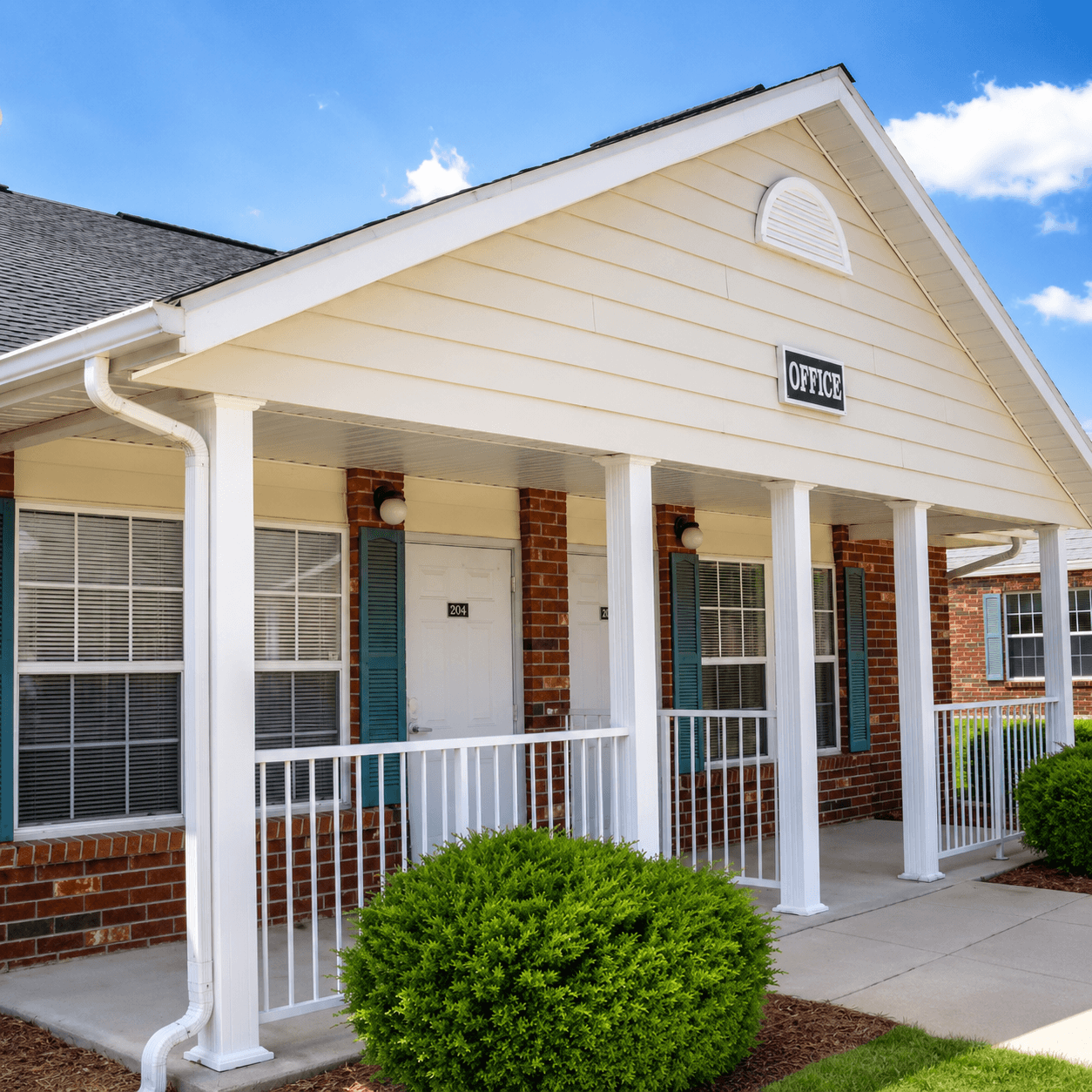A small white building with a sign that says "OFFICE" on the front.